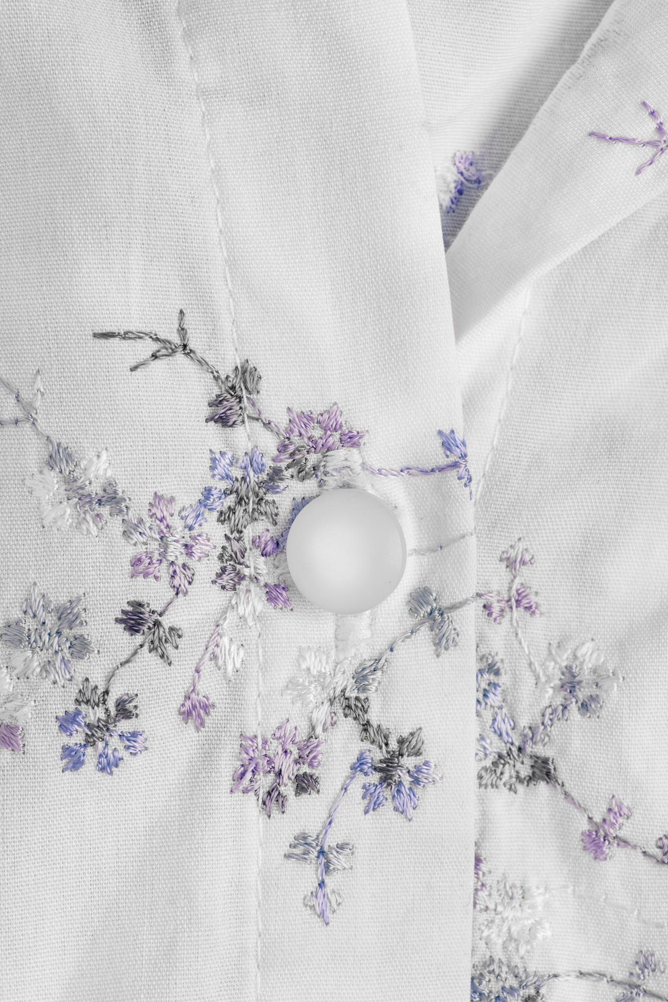 embroidered linen table runner with floral motif