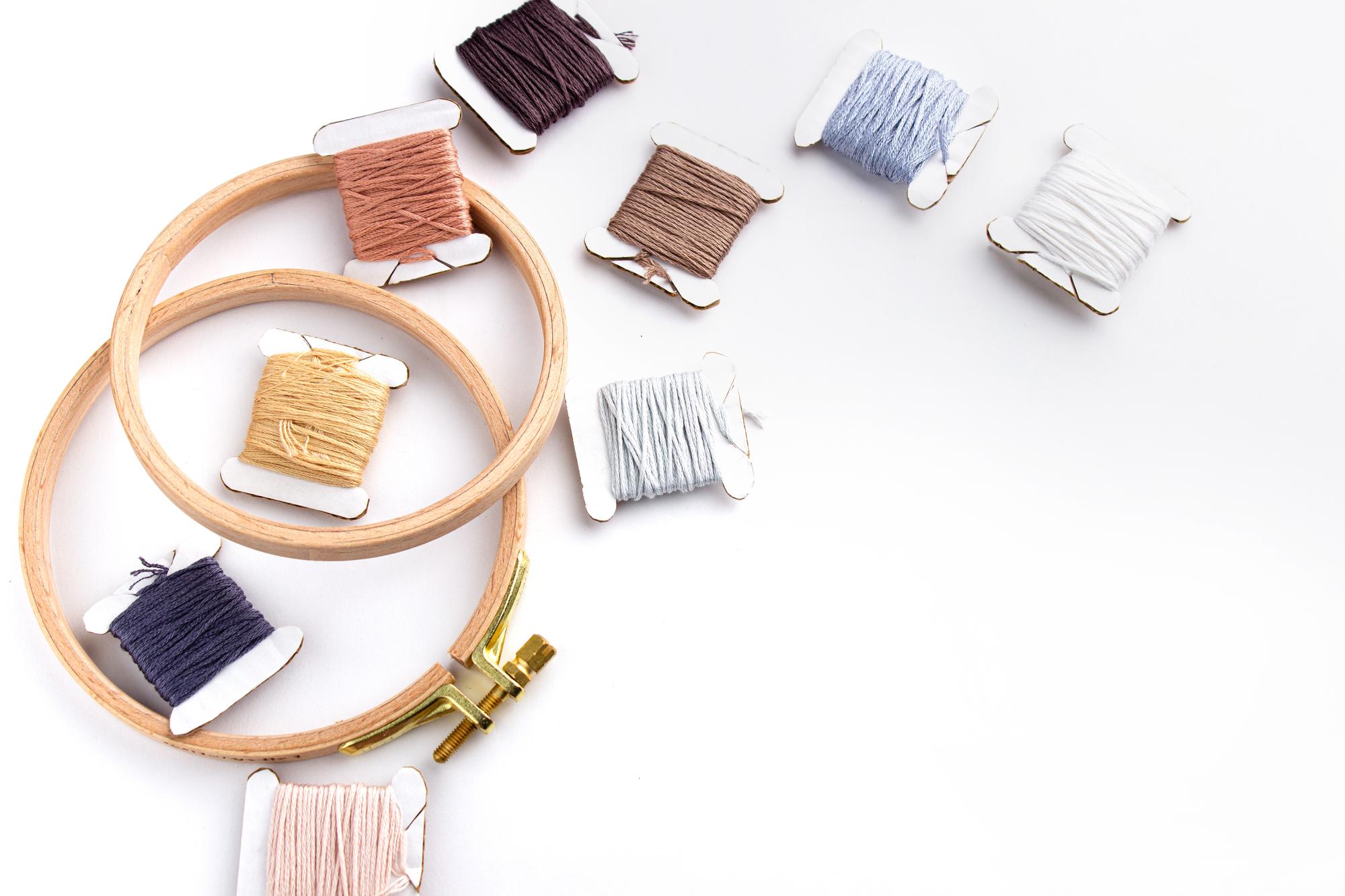 flat lay of embroidered samples and threads